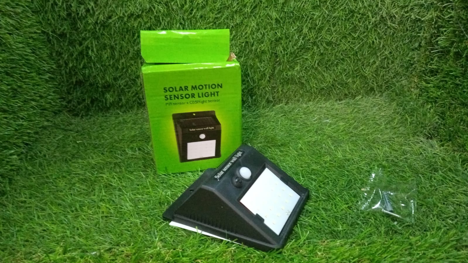 Black solar LED security light for gardens. Black solar LED security light for gardens.